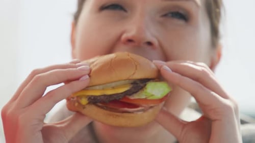 Closeup Funny Face Young Woman Eating Burger at Outside Vegetarian Restaurant