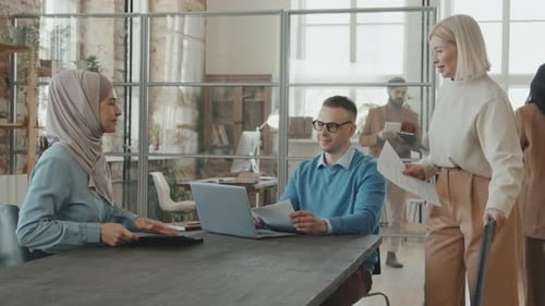 Businesspeople Conducting Job Interview in Office