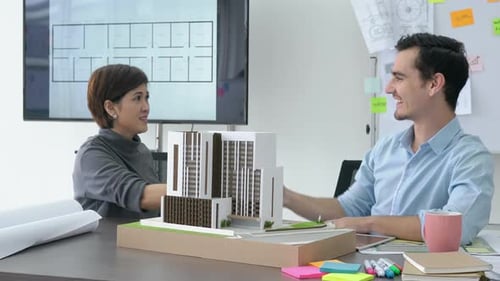 Man and woman working in office