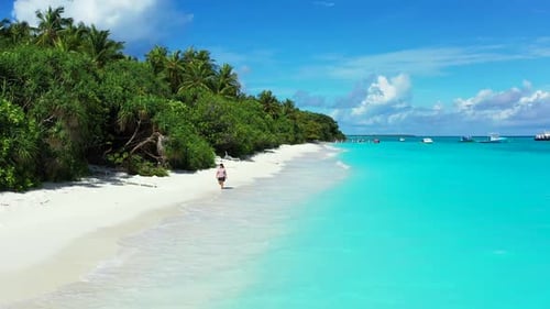 Girl loves life on exotic resort beach lifestyle by blue ocean with clean sandy background of the Ma