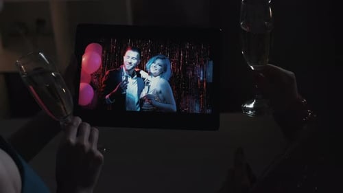 Virtual Celebration With Champagne Toast on Tablet