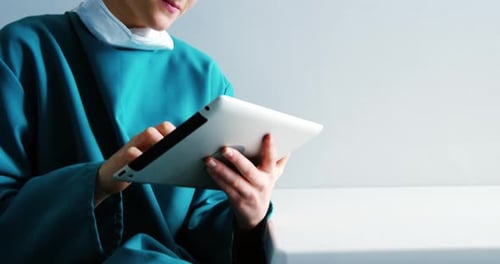 Female doctor using digital tablet