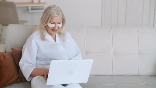 Senior Woman Using Laptop at Home