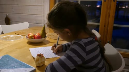 Pretty School Girl at Home, Writing a Homework. Child Sitting at Table and Write