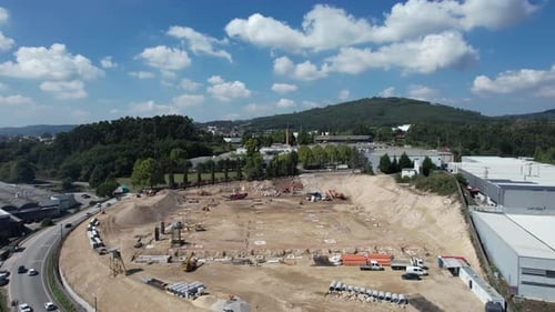 Aerial View of Construction Site Near Urban Area