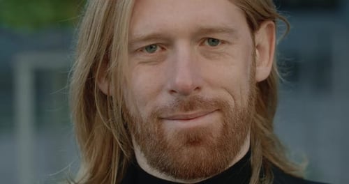Bearded Man Smiling in a Close Up Portrait