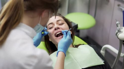 Oral Hygiene and Dental Care Doctor Dentist Working with Patient in Dental Clinic