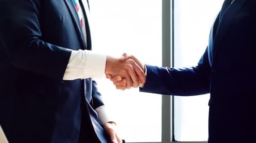 Business People Handshake in Corporate Office