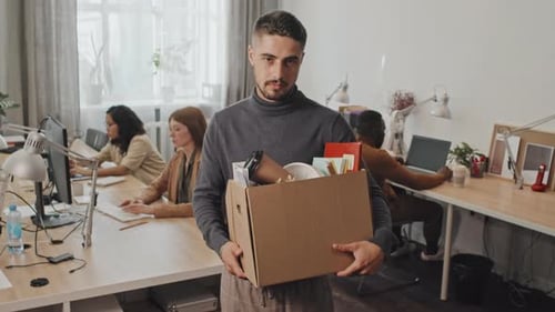 Portrait of Ex-Worker with Belongings in Box in Office