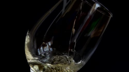 Pouring White Wine into Glass Close Up