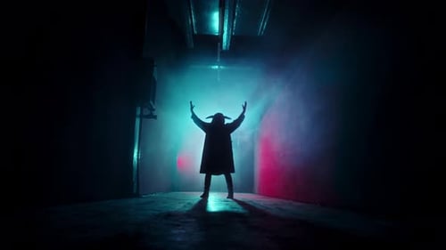 Silhouette in Dark Hallway with Horned Headpiece