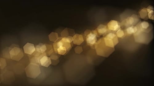 Golden Hexagonal Bokeh Light Particles Background