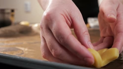 Woman Baking Christmas Cookies in the Kitchen