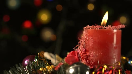 Festive Red Holiday Candle with Christmas Decorations