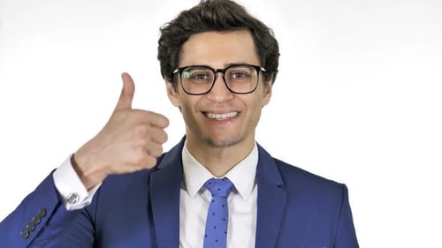 Smiling Man in Suit Gives Thumbs Up
