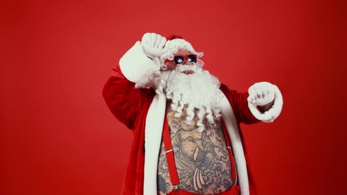 Tattooed Santa Claus Dancing Merrily on Red Background