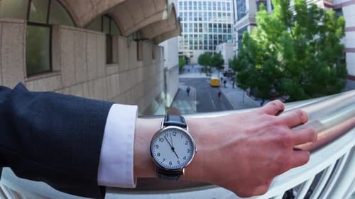 Man Checking Watch in the City
