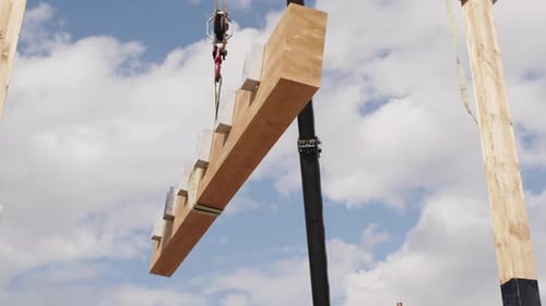 Crane Moves Wooden Beam By Air