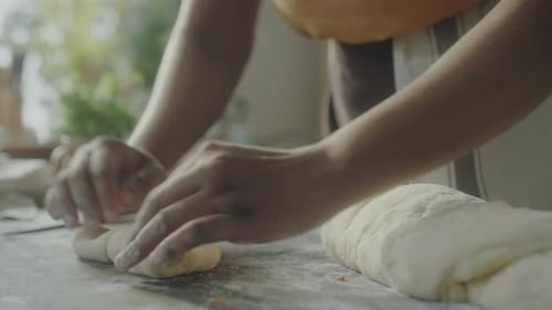 Rolling Up Dough Filled with Bacon