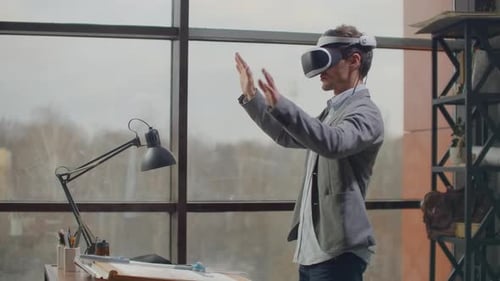 Man Using Virtual Reality Headset in Office