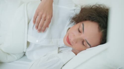 Woman Sleeping and Waking up in Bed
