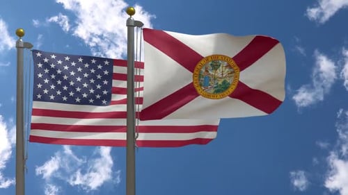United States and Florida State Flags Waving in the Wind