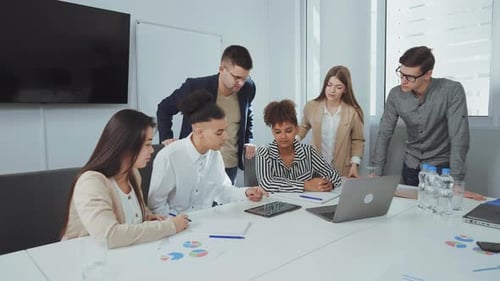 Diverse Team Collaborating on Business Strategy in Modern Office