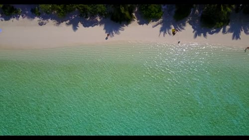 Aerial top view scenery of tranquil coast beach voyage by aqua blue sea and white sand background of