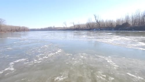 Aerial Shot Of Drifting Ice On River
