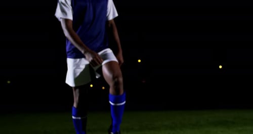 Soccer Player Footwork Controlling Ball on Field at Night