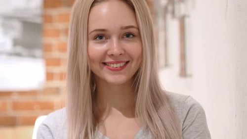 Portrait of Smiling Young Woman, Loft Background