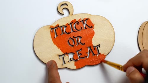 Halloween paints and decor. Children make Halloween decorations with their own hands.