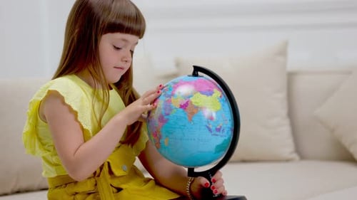 Curious Girl Exploring the World with Globe