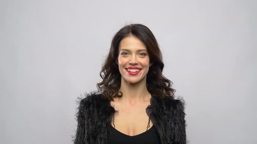 Happy Beautiful Young Woman in Party Clothes