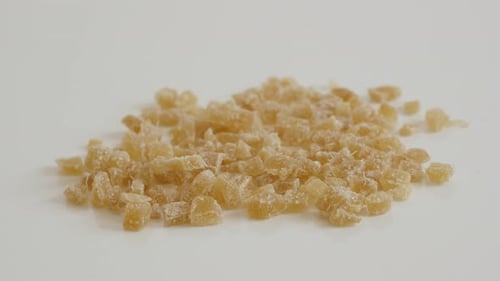 Candied ginger root on the table close-up slow tilt 4K 2160p 30fps UltraHD footage - Crystallized Z