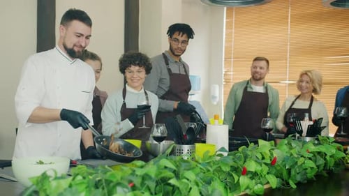 Chef Cooking for Students in a Cooking Class