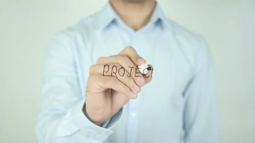 Man Writes Project on Clear Screen