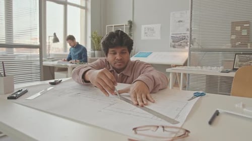 Biracial Architect Drawing House Plan at Office Desk