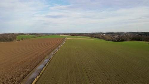 Areal View of Agricultural Field Against Cloudy Sky