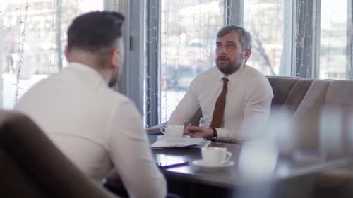 Two Businessmen on Coffee Break