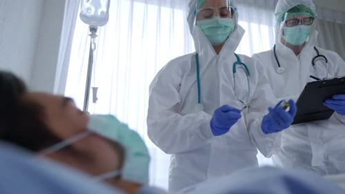 Medical Staff Treat Patient in Hospital During Pandemic