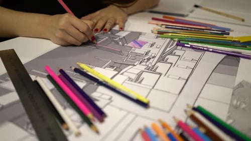 Designer Coloring Architectural Drawing With Colored Pencils