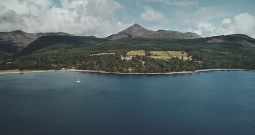 Scotland Brodick Ocean Bay Aerial View Alone Sailboat at FirthofClyde Gulf Water