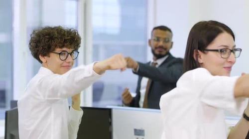 Excited Team Celebrates Success in Workplace