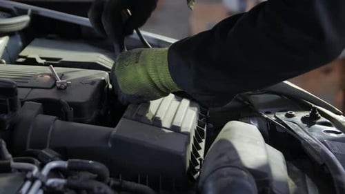 Mechanic Unscrews The Bolts