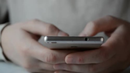 Close up of Hands Using a Smart Phone