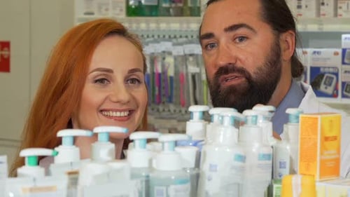 Pharmacists Looking at Products in a Pharmacy Aisle