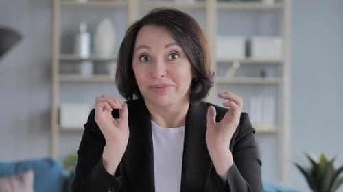 Woman Expressing Delight and Surprise at Camera