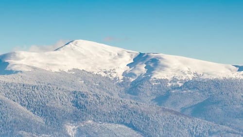Snowy Mountain Peaks in Winter Landscape