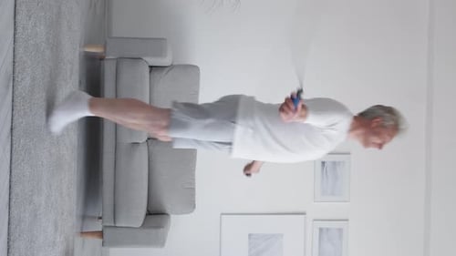 Mature Man Jumps Rope Indoors